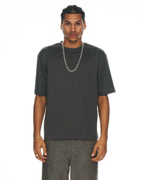 model wearing clear Odin resin link necklace with urban styling